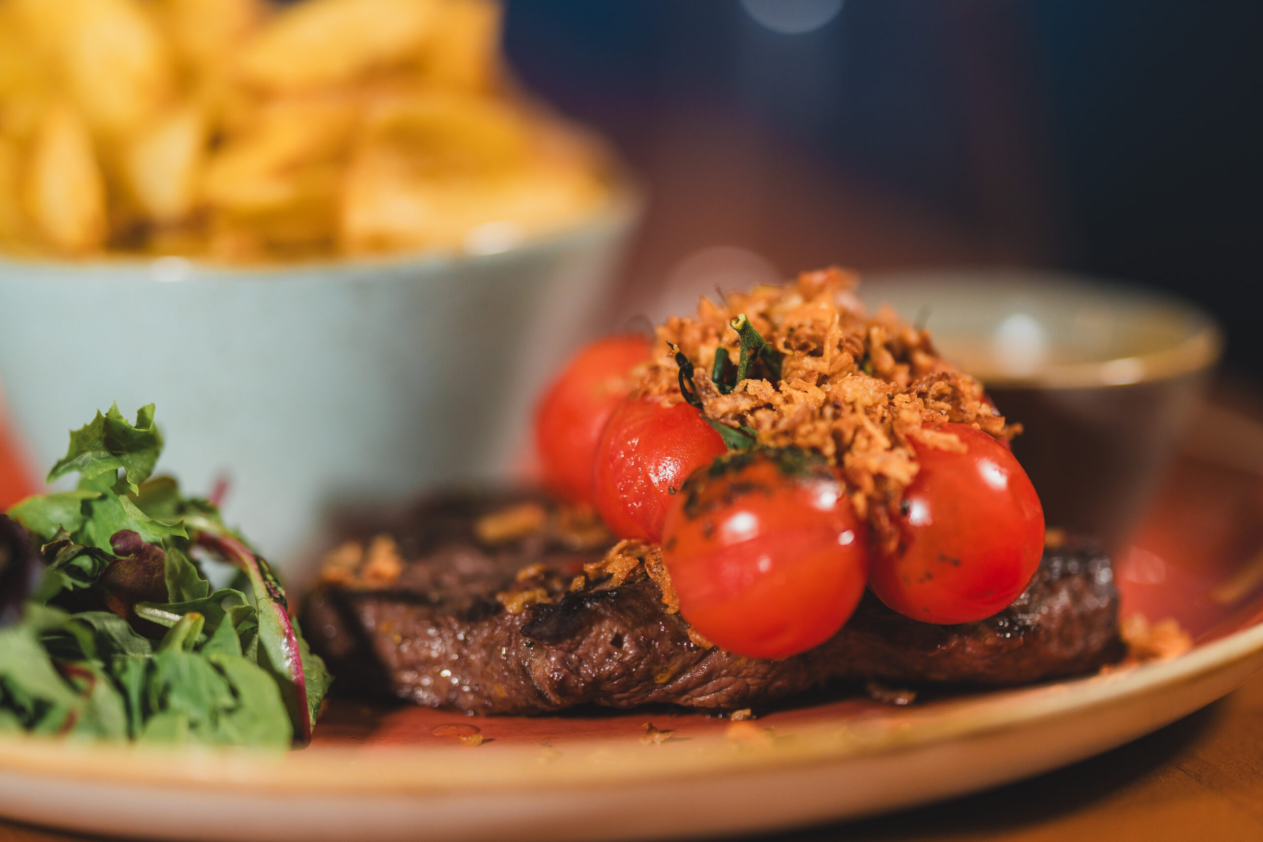 Steak with tomatoes and crispy onions on top. autumn food enniskillen