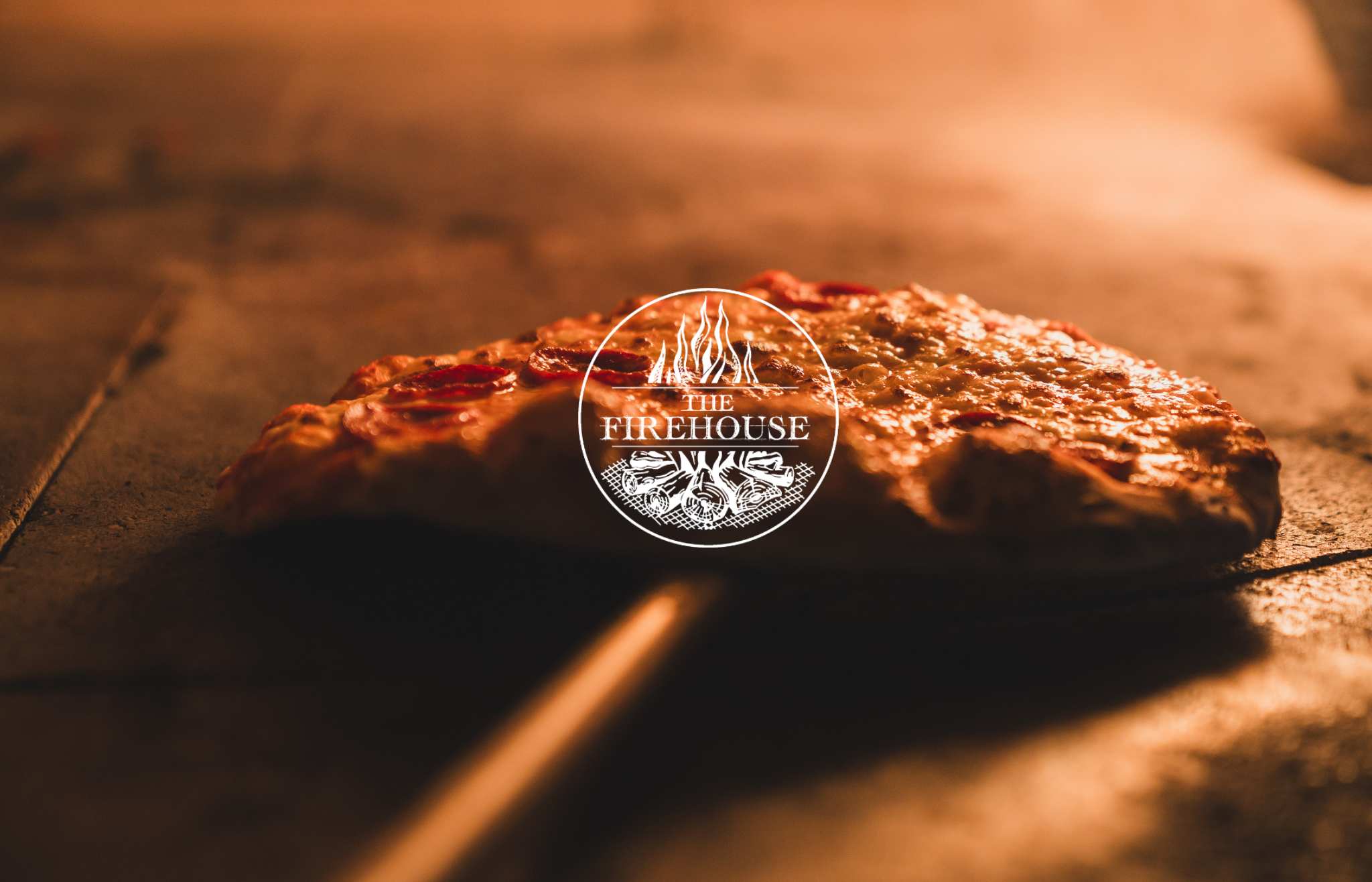fresh pizza being cooked in our famous bertha oven at The Firehouse Firehouse Enniskillen dining guide