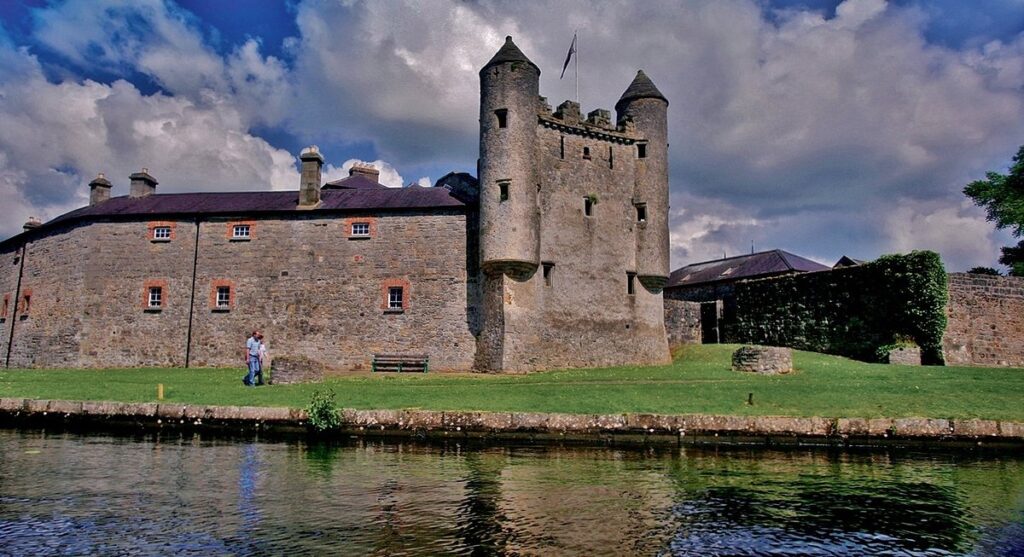 view of Enniskillen Castle with people walking past